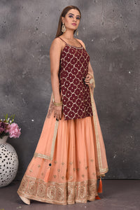 Shop gorgeous maroon and peach embroidered sharara suit online in USA with dupatta. Look stylish at parties and wedding festivities in designer dresses, Indowestern outfits, Anarkali suits, wedding lehengas, palazzo suits, sharara suits from Pure Elegance Indian clothing store in USA.-side