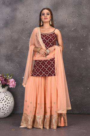 Shop gorgeous maroon and peach embroidered sharara suit online in USA with dupatta. Look stylish at parties and wedding festivities in designer dresses, Indowestern outfits, Anarkali suits, wedding lehengas, palazzo suits, sharara suits from Pure Elegance Indian clothing store in USA.-front