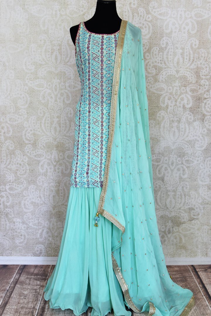 Shop stunning pastel blue embroidered sharara suit online in USA with dupatta. Get set to dazzle on festive occasions in this exquisite designer suits, Anarkali dress, sharara suits, salwar suits, palazzo suits from Pure Elegance Indian fashion store in USA.-full view