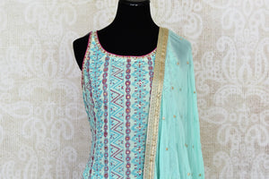 Shop stunning pastel blue embroidered sharara suit online in USA with dupatta. Get set to dazzle on festive occasions in this exquisite designer suits, Anarkali dress, sharara suits, salwar suits, palazzo suits from Pure Elegance Indian fashion store in USA.-front