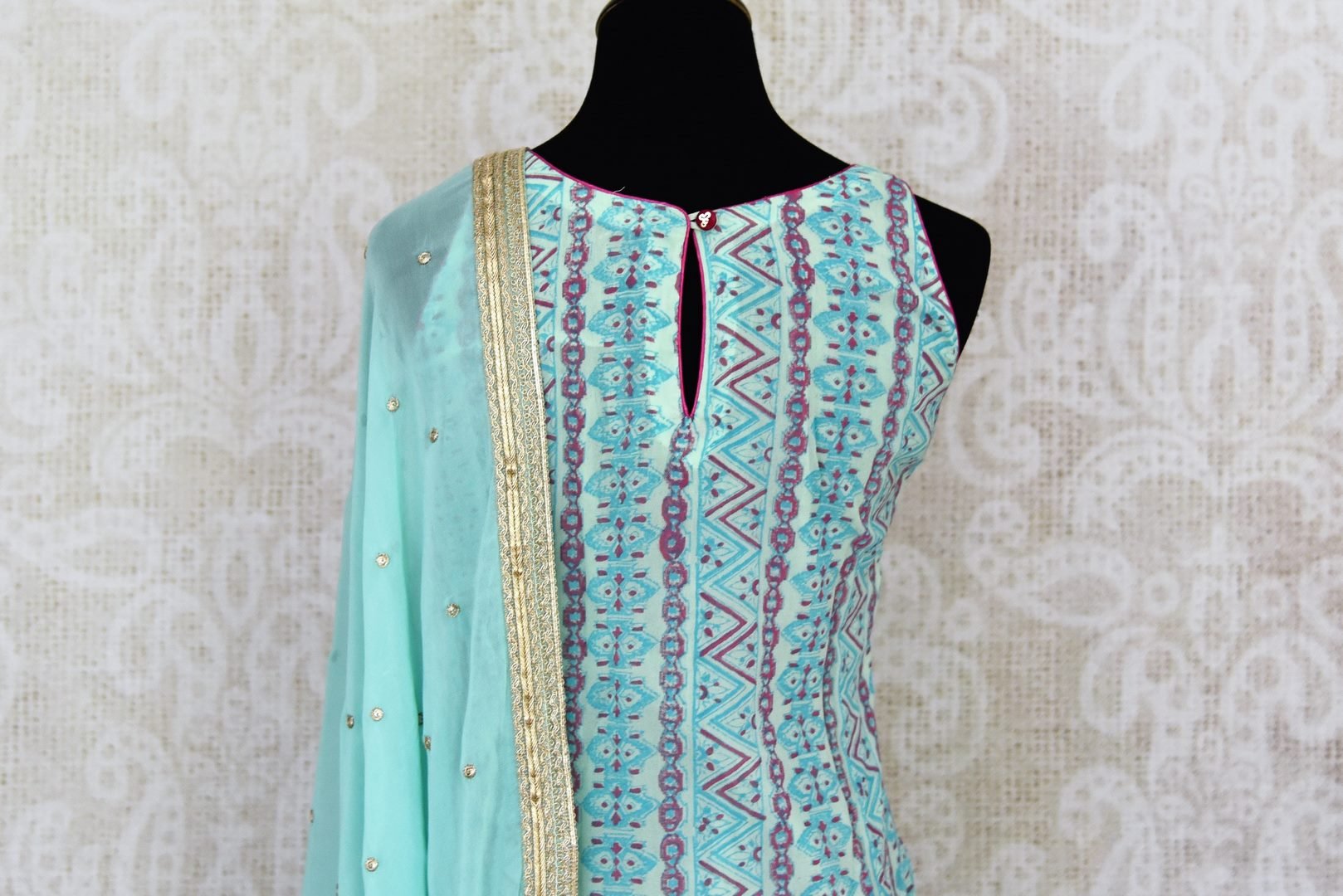 Shop stunning pastel blue embroidered sharara suit online in USA with dupatta. Get set to dazzle on festive occasions in this exquisite designer suits, Anarkali dress, sharara suits, salwar suits, palazzo suits from Pure Elegance Indian fashion store in USA.-back