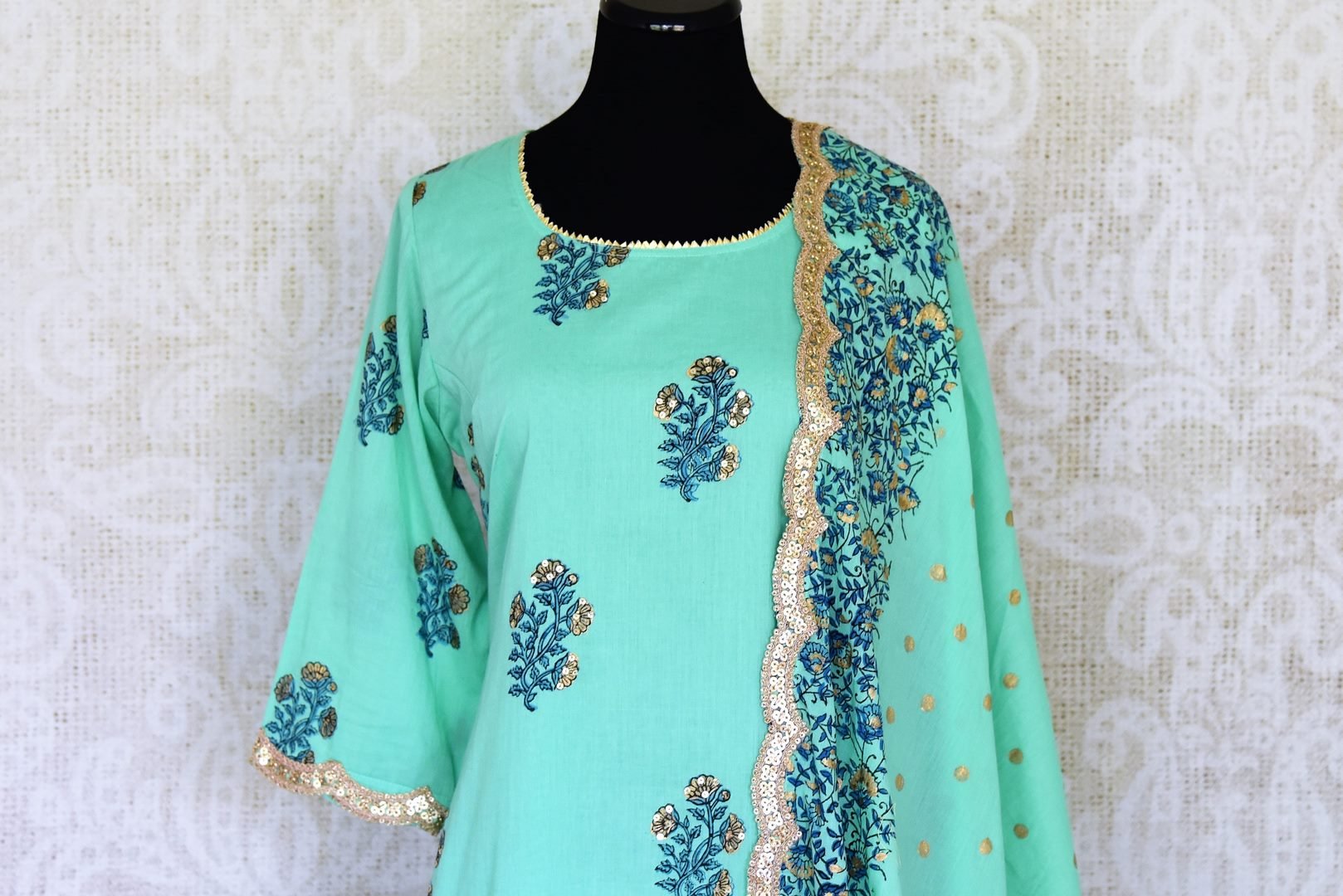 Buy beautiful green Kalamkari print sharara suit online in USA with gota sequin work, Be a vision of style and elegance on festive occasions in designer suits, desinger lehenga, shararas suits, Anarkali suit, designer gowns from Pure Elegance Indian fashion store in USA. -closeup