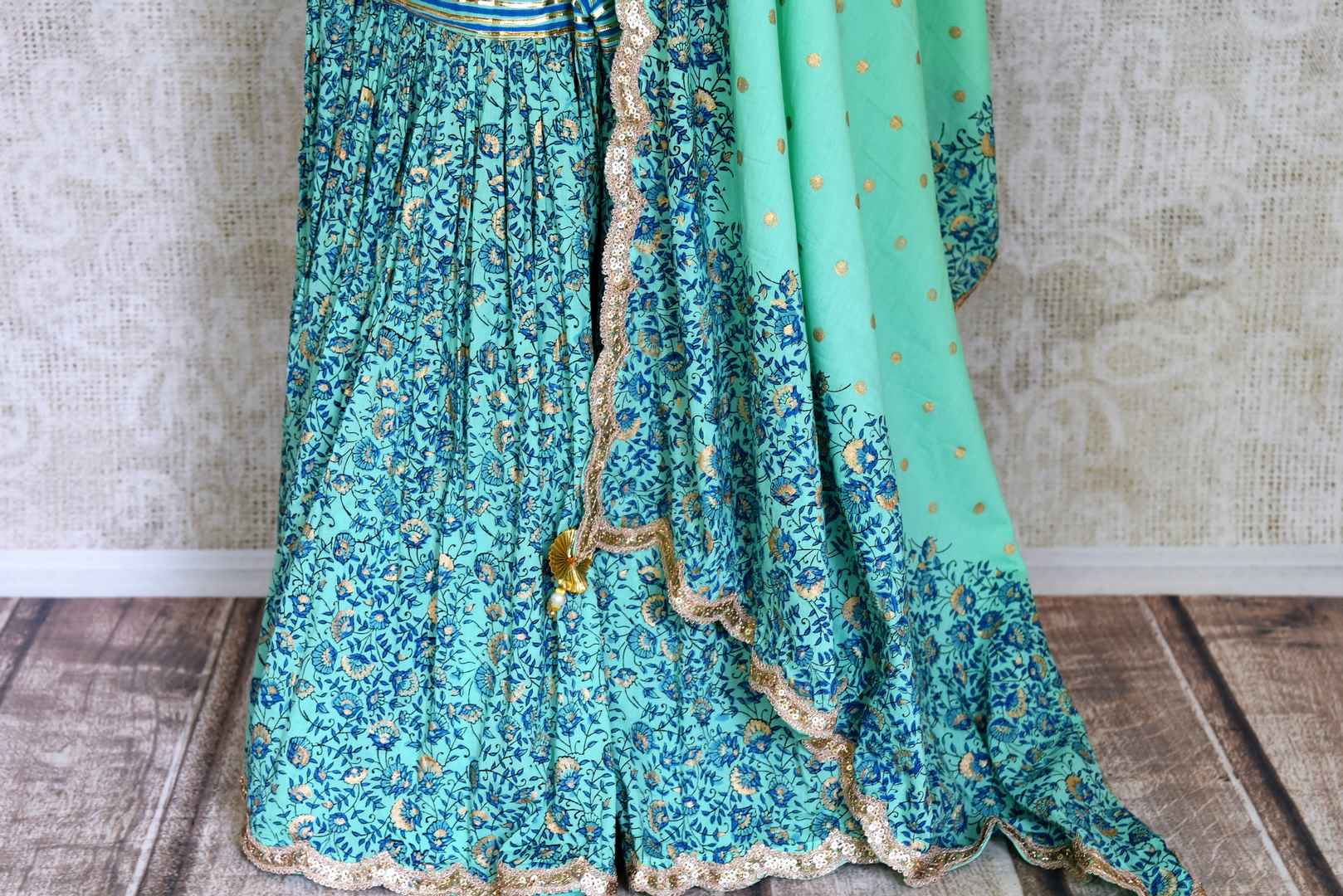 Buy beautiful green Kalamkari print sharara suit online in USA with gota sequin work, Be a vision of style and elegance on festive occasions in designer suits, desinger lehenga, shararas suits, Anarkali suit, designer gowns from Pure Elegance Indian fashion store in USA. -sharara