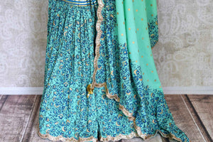 Buy beautiful green Kalamkari print sharara suit online in USA with gota sequin work, Be a vision of style and elegance on festive occasions in designer suits, desinger lehenga, shararas suits, Anarkali suit, designer gowns from Pure Elegance Indian fashion store in USA. -sharara