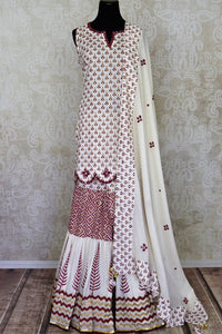 Buy beautiful white Kalamkari cotton sharara suit online in USA with mirror work. Get set to dazzle on festive occasions in this exquisite designer suits, Anarkali dress, sharara suits, salwar suits, palazzo suits from Pure Elegance Indian fashion store in USA.-full view