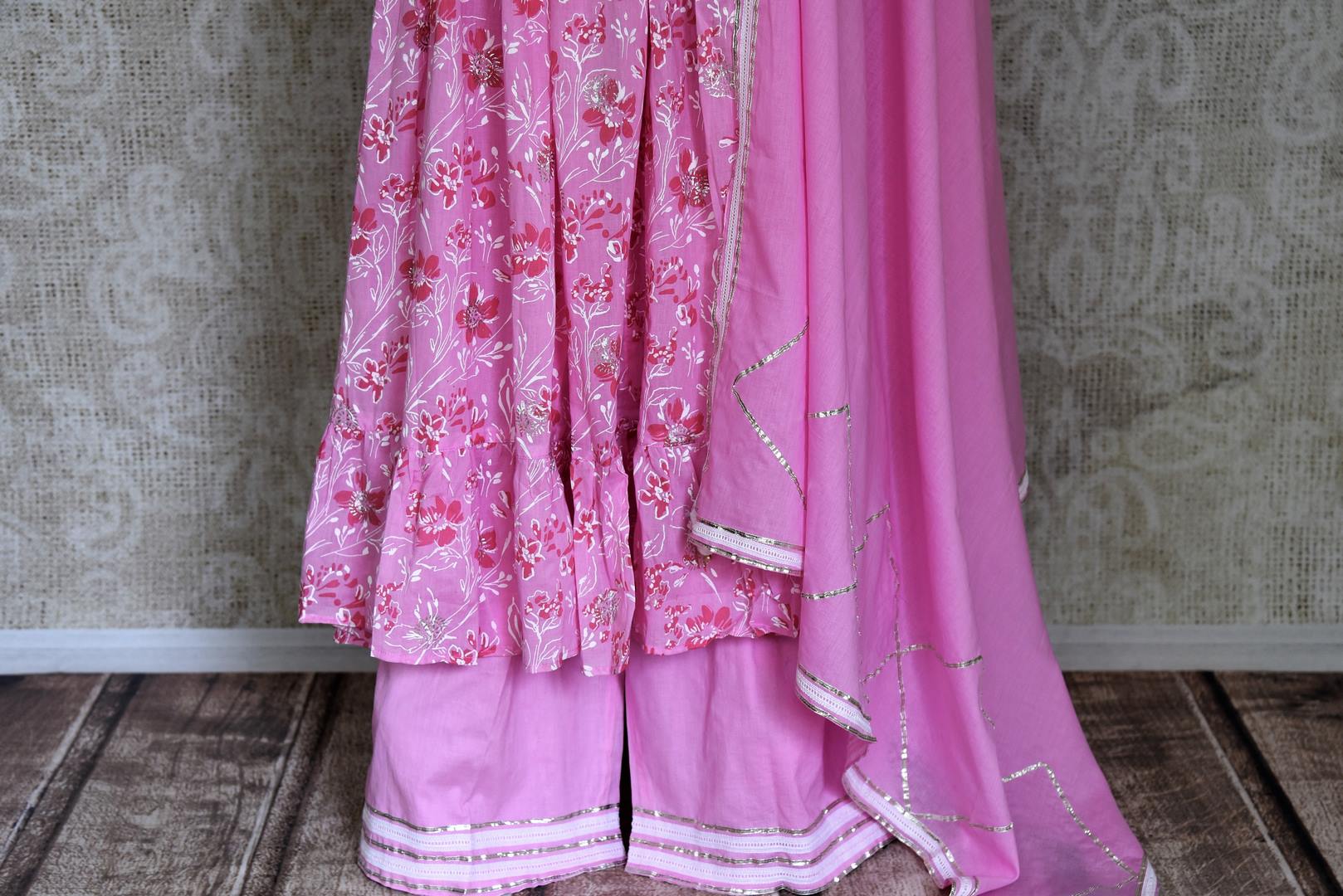 Buy beautiful light pink Kadhi print Anarkali suit online in USA with dupatta, Be a vision of style and elegance on festive occasions in designer suits, desinger lehenga, shararas suits, Anarkali suit, designer gowns from Pure Elegance Indian fashion store in USA. -palazzo