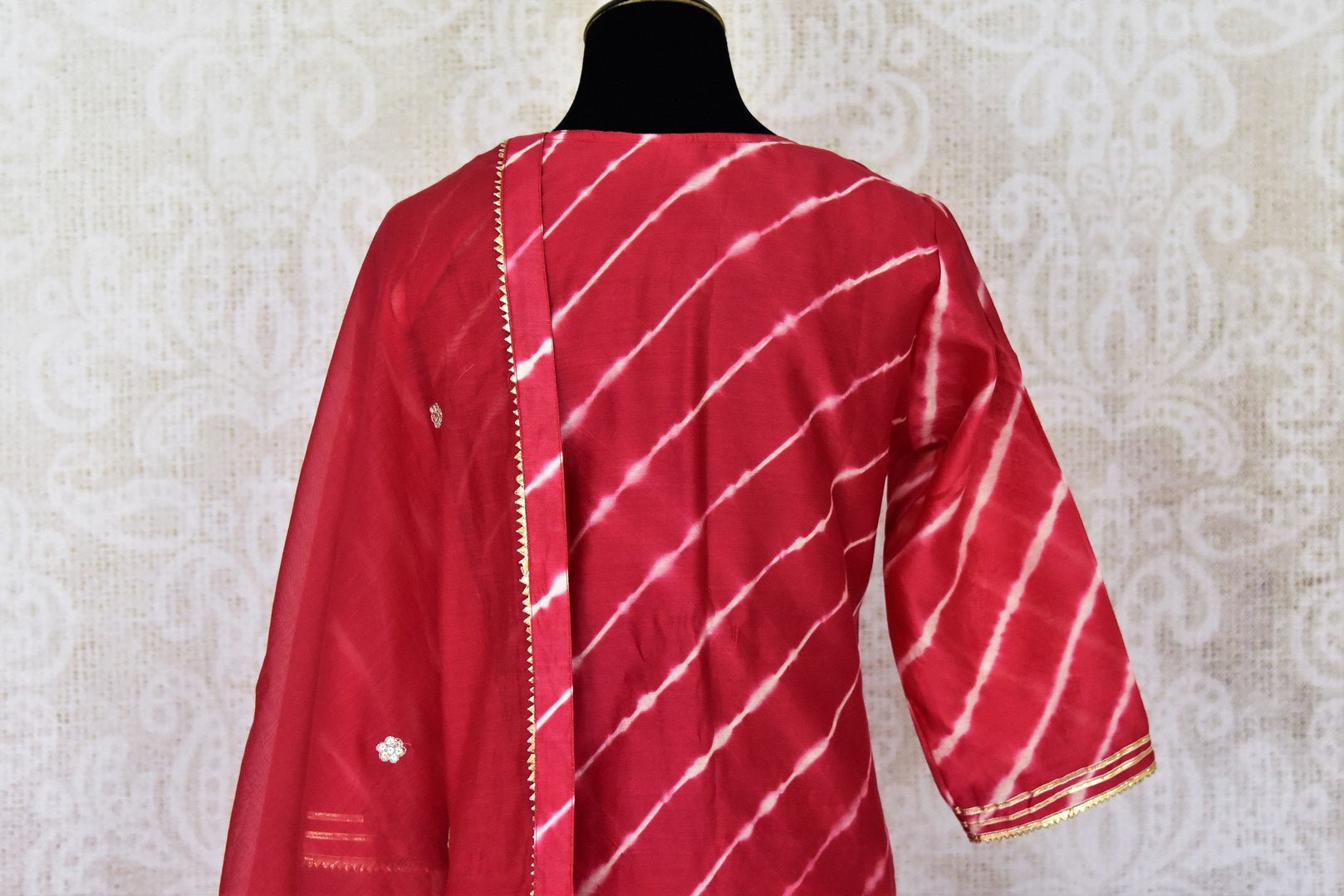 Shop stunning red chanderi silk sharara suit online in USA with dupatta. Get set to dazzle on festive occasions in this exquisite designer suits, Anarkali dress, sharara suits, salwar suits, palazzo suits from Pure Elegance Indian fashion store in USA.-back