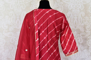 Shop stunning red chanderi silk sharara suit online in USA with dupatta. Get set to dazzle on festive occasions in this exquisite designer suits, Anarkali dress, sharara suits, salwar suits, palazzo suits from Pure Elegance Indian fashion store in USA.-back