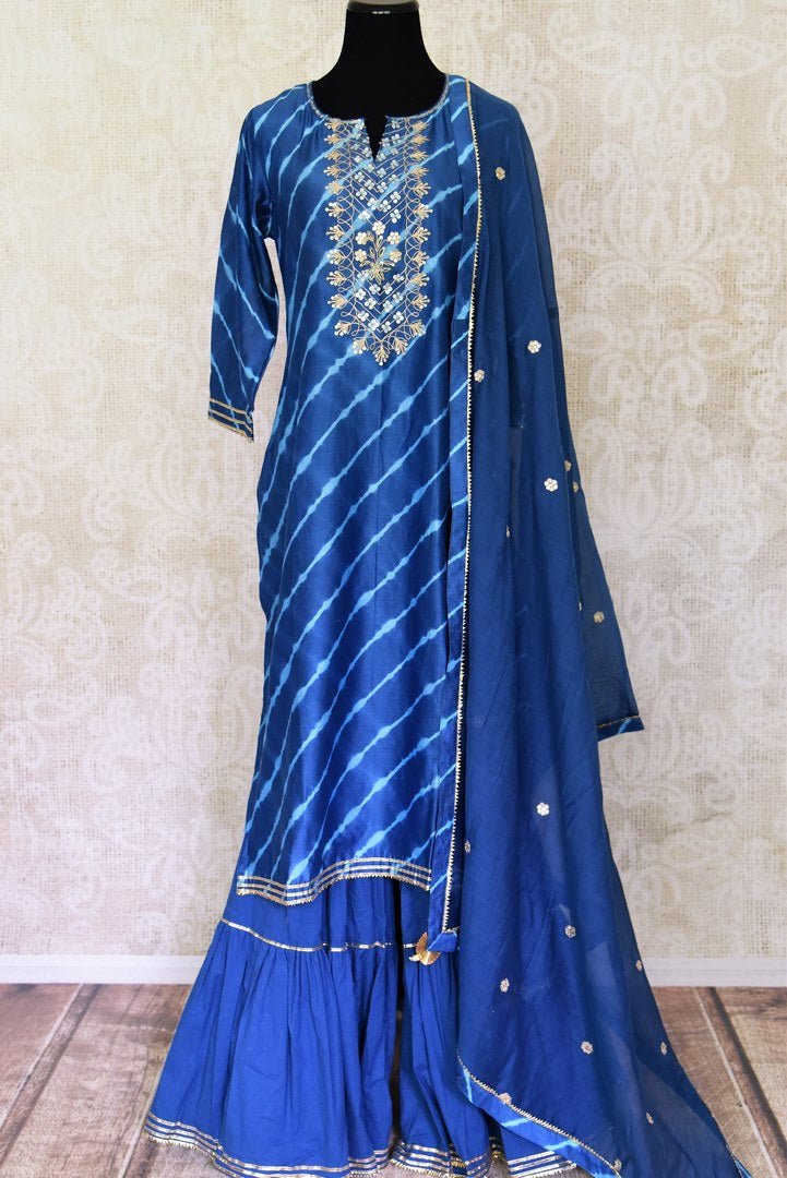 Buy beautiful royal blue chanderi silk sharara suit online in USA with dupatta. Get set to dazzle on festive occasions in this exquisite designer suits, Anarkali dress, sharara suits, salwar suits, palazzo suits from Pure Elegance Indian fashion store in USA.-full view