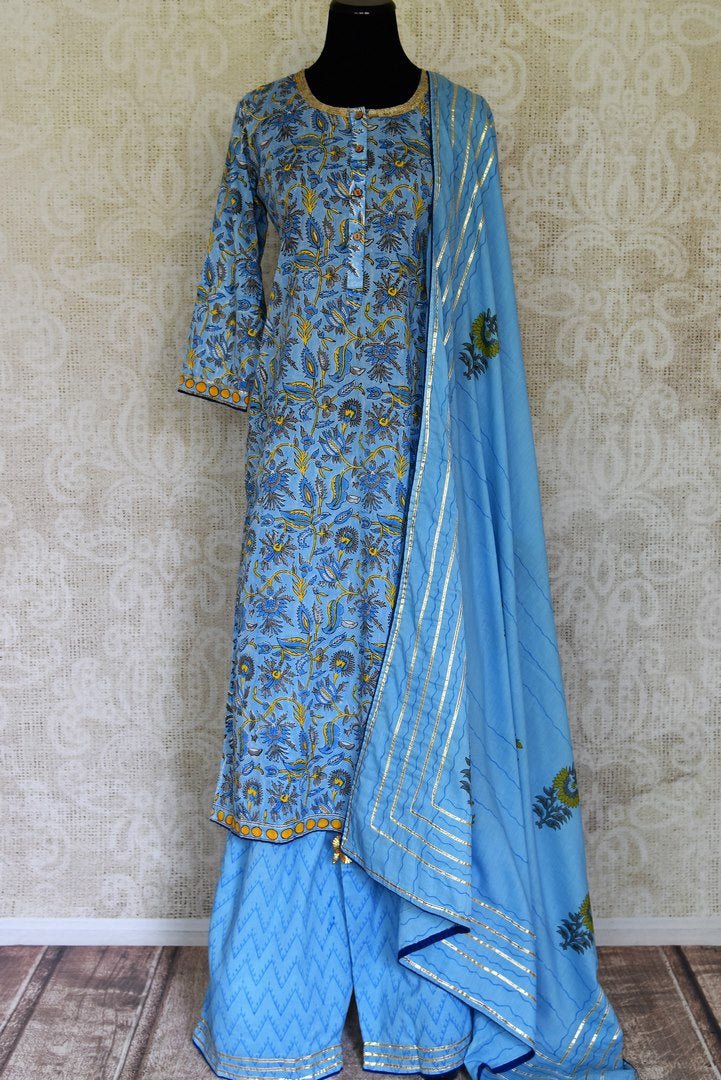 Shop beautiful blue Kalamkari print and gota lace palazzo suit online in USA, Be a vision of style and elegance on festive occasions in designer suits, desinger lehenga, sharara suits, Anarkali suit, designer gowns from Pure Elegance Indian fashion store in USA. -full view
