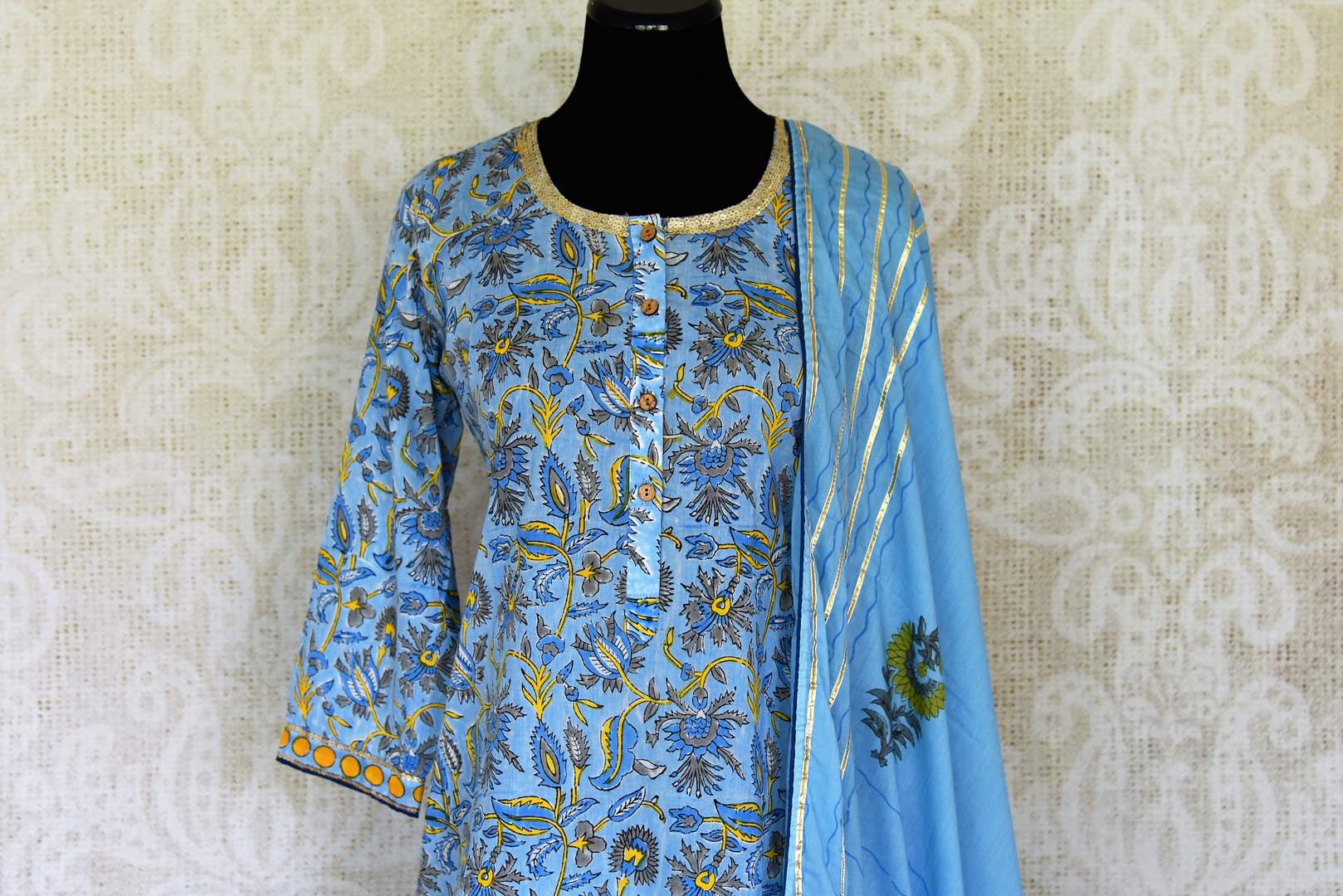 Shop beautiful blue Kalamkari print and gota lace palazzo suit online in USA, Be a vision of style and elegance on festive occasions in designer suits, desinger lehenga, sharara suits, Anarkali suit, designer gowns from Pure Elegance Indian fashion store in USA. -front
