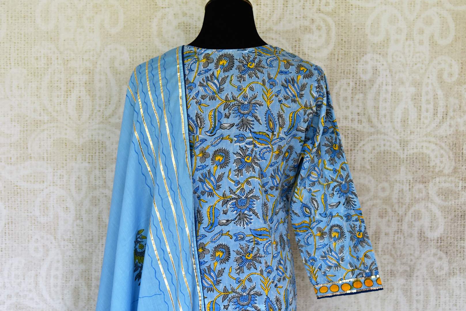 Shop beautiful blue Kalamkari print and gota lace palazzo suit online in USA, Be a vision of style and elegance on festive occasions in designer suits, desinger lehenga, sharara suits, Anarkali suit, designer gowns from Pure Elegance Indian fashion store in USA.  -back