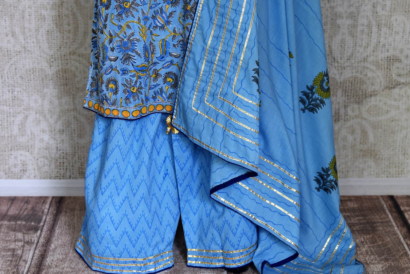 Shop beautiful blue Kalamkari print and gota lace palazzo suit online in USA, Be a vision of style and elegance on festive occasions in designer suits, desinger lehenga, sharara suits, Anarkali suit, designer gowns from Pure Elegance Indian fashion store in USA. -sharara