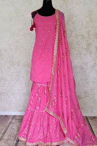 Buy beautiful pink cotton sharara suit online in USA with gota work and dupatta. Get set to dazzle on festive occasions in this exquisite designer suits, Anarkali dress, sharara suits, salwar suits, palazzo suits from Pure Elegance Indian fashion store in USA.-full view