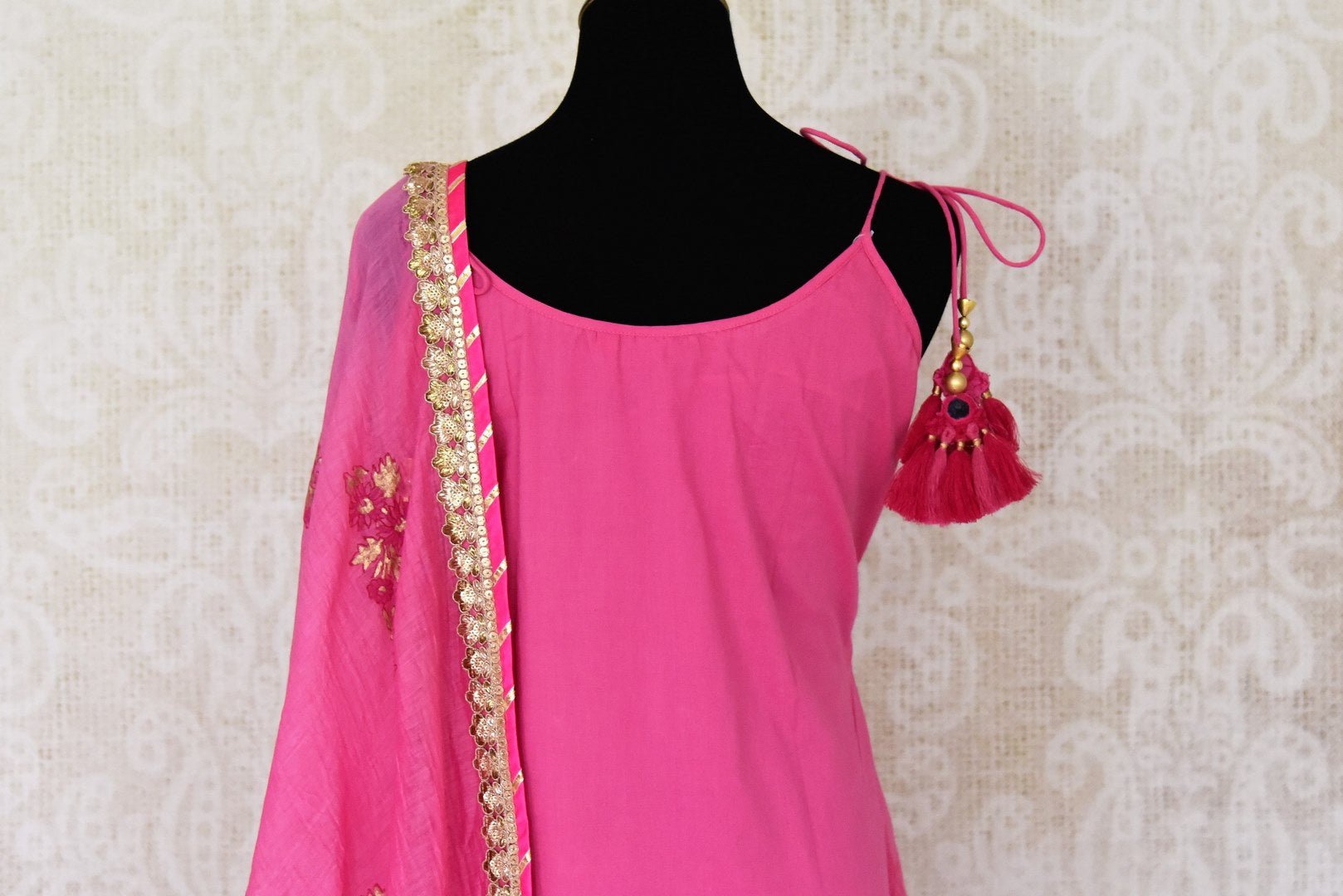 Buy beautiful pink cotton sharara suit online in USA with gota work and dupatta. Get set to dazzle on festive occasions in this exquisite designer suits, Anarkali dress, sharara suits, salwar suits, palazzo suits from Pure Elegance Indian fashion store in USA.-back