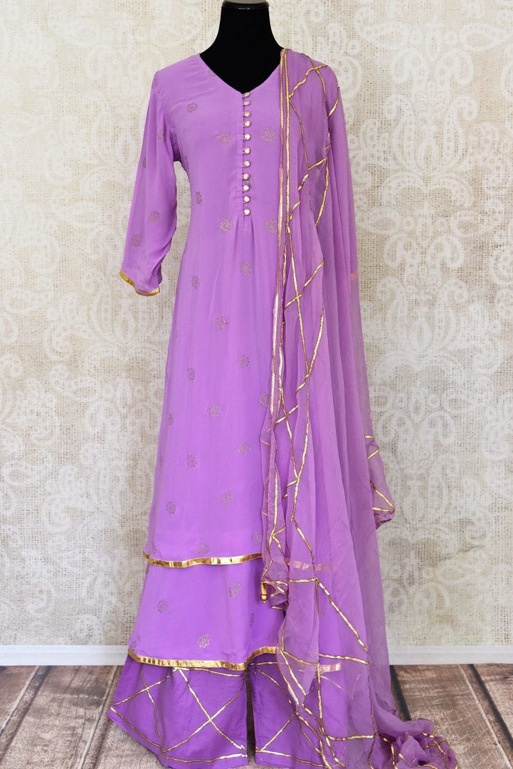 Shop beautiful lavender georgette sharara suit online in USA with gota work and dupatta. Get set to dazzle on festive occasions in this exquisite designer suits, Anarkali dress, sharara suits, salwar suits, palazzo suits from Pure Elegance Indian fashion store in USA.-full view