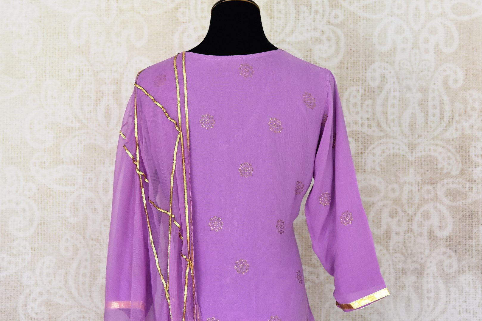 Shop beautiful lavender georgette sharara suit online in USA with gota work and dupatta. Get set to dazzle on festive occasions in this exquisite designer suits, Anarkali dress, sharara suits, salwar suits, palazzo suits from Pure Elegance Indian fashion store in USA.-back