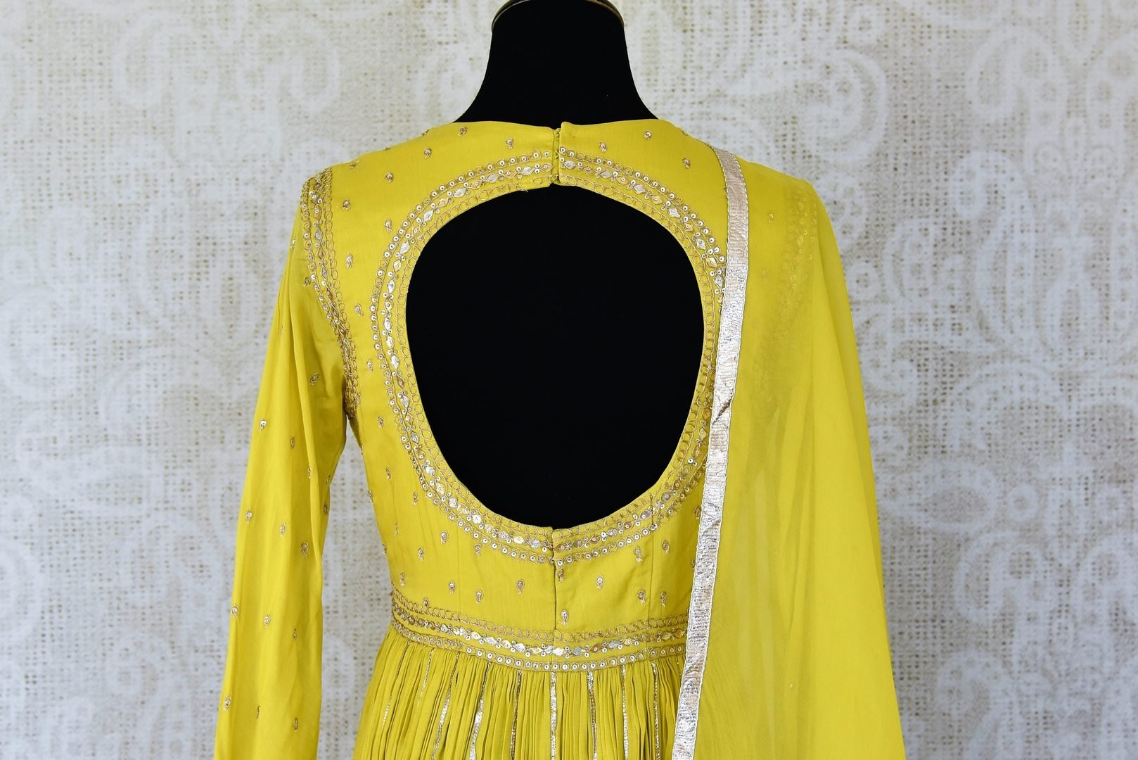 Shop beautiful bright yellow silk Anarkali suit online in USA with gota work. Add an elegant touch to your ethnic style with beautiful designer suits, Anarkali suits, gharara suits, salwar suits, sharara suits from Pure Elegance Indian fashion store in USA.-back