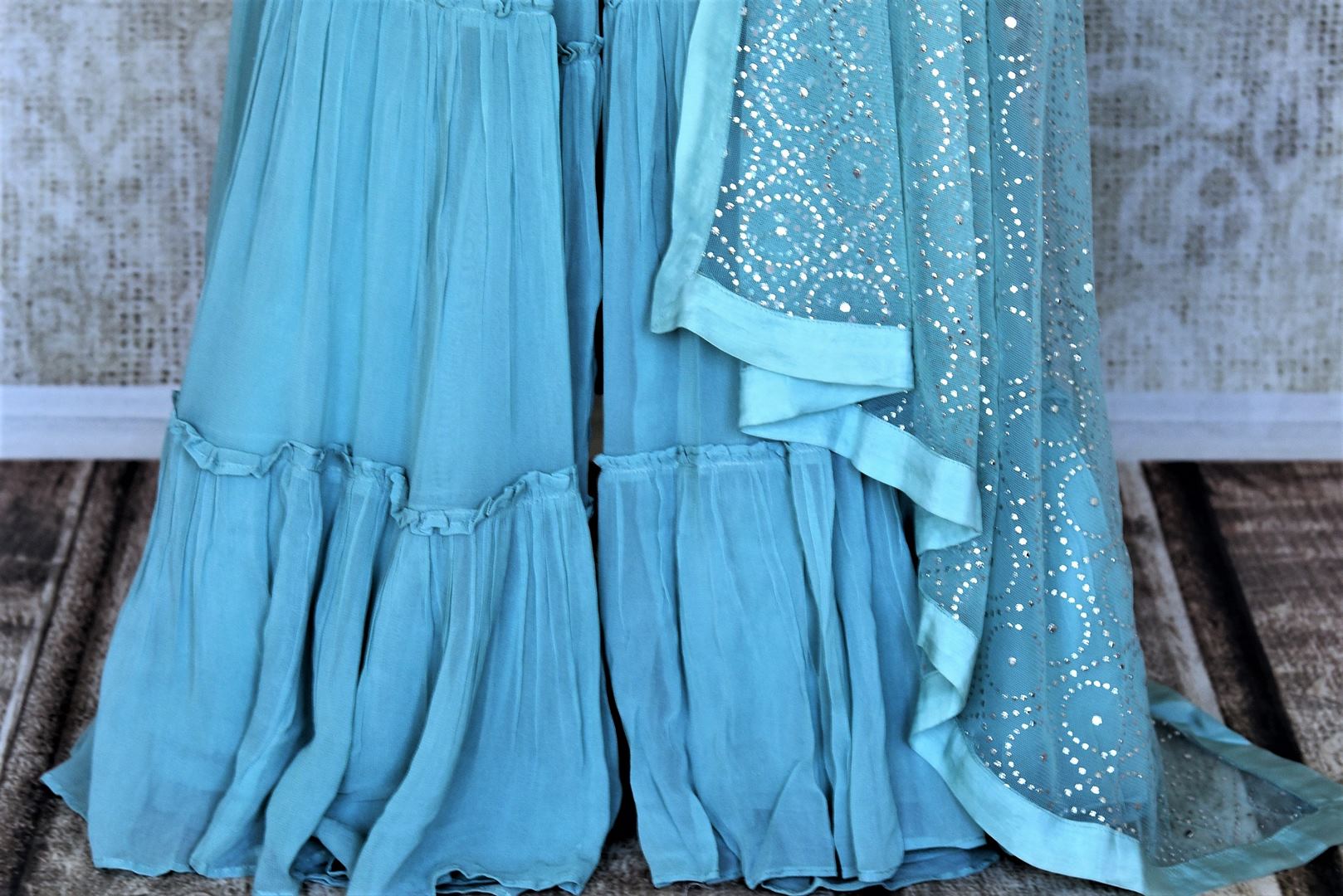 Shop stunning light blue sequin work georgette sharara suit online in USA. Add an elegant touch to your ethnic style with beautiful designer suits, Anarkali suits, gharara suits, salwar suits, sharara suits from Pure Elegance Indian fashion store in USA.-sharara
