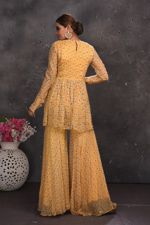 Shop stunning pastel orange printed gharara suit online in USA. Look your best at weddings and special occasions in exclusive designer lehengas, Anarkali suits, sharara suits. designer gowns and Indian dresses from Pure Elegance Indian fashion store in USA.-back