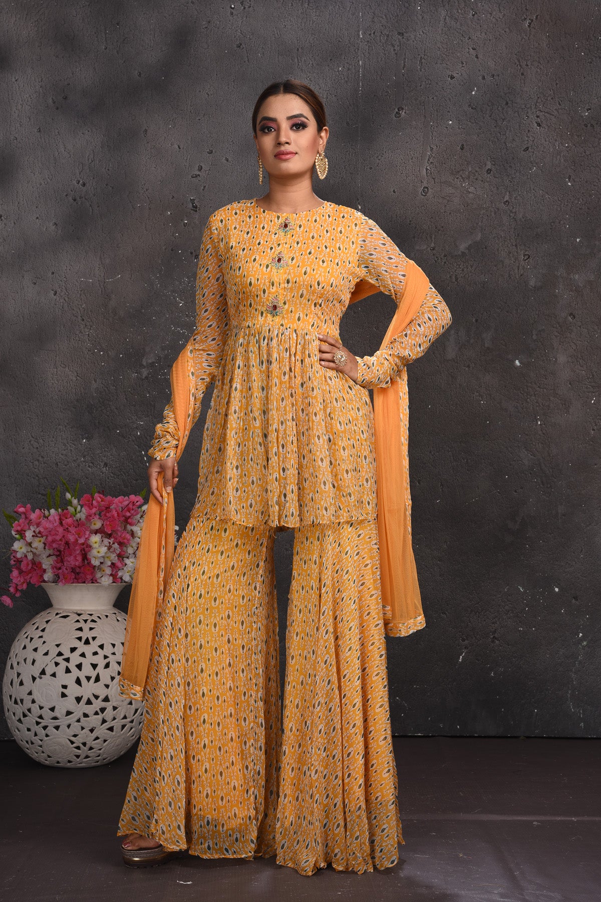 Shop stunning pastel orange printed gharara suit online in USA. Look your best at weddings and special occasions in exclusive designer lehengas, Anarkali suits, sharara suits. designer gowns and Indian dresses from Pure Elegance Indian fashion store in USA.-full view