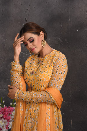 Shop stunning pastel orange printed gharara suit online in USA. Look your best at weddings and special occasions in exclusive designer lehengas, Anarkali suits, sharara suits. designer gowns and Indian dresses from Pure Elegance Indian fashion store in USA.-closeup