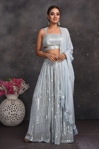 Buy beautiful light grey embellished palazzo crop top online in USA with dupatta. Look your best at weddings and special occasions in exclusive designer lehengas, Anarkali suits, sharara suits. designer gowns and Indian dresses from Pure Elegance Indian fashion store in USA.-full view