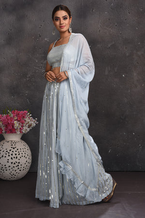 Buy beautiful light grey embellished palazzo crop top online in USA with dupatta. Look your best at weddings and special occasions in exclusive designer lehengas, Anarkali suits, sharara suits. designer gowns and Indian dresses from Pure Elegance Indian fashion store in USA.-side