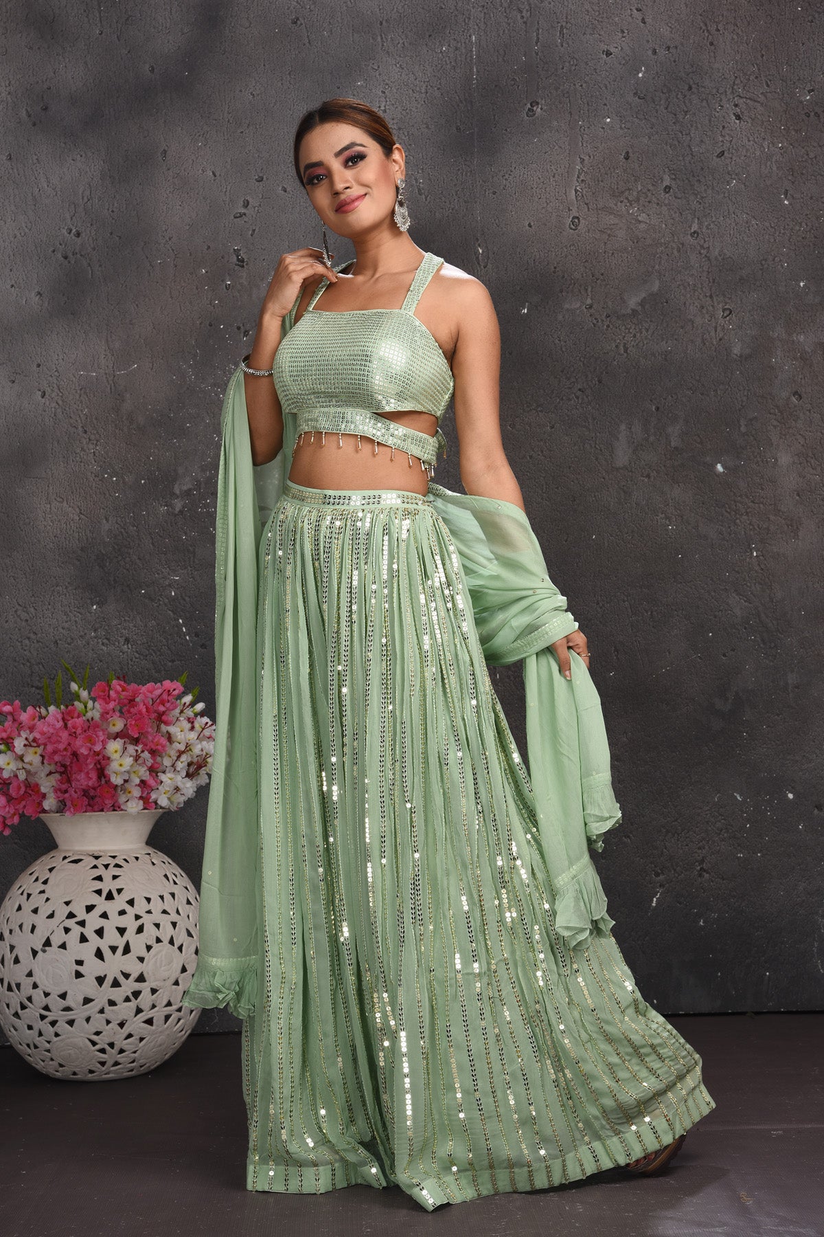Buy beautiful sage green embellished palazzo crop top online in USA with dupatta. Look your best at weddings and special occasions in exclusive designer lehengas, Anarkali suits, sharara suits. designer gowns and Indian dresses from Pure Elegance Indian fashion store in USA.-palazzo