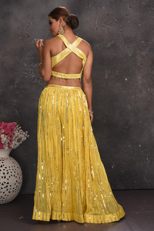 Buy stunning light yellow embellished palazzo crop top online in USA with dupatta. Look your best at weddings and special occasions in exclusive designer lehengas, Anarkali suits, sharara suits. designer gowns and Indian dresses from Pure Elegance Indian fashion store in USA.-back