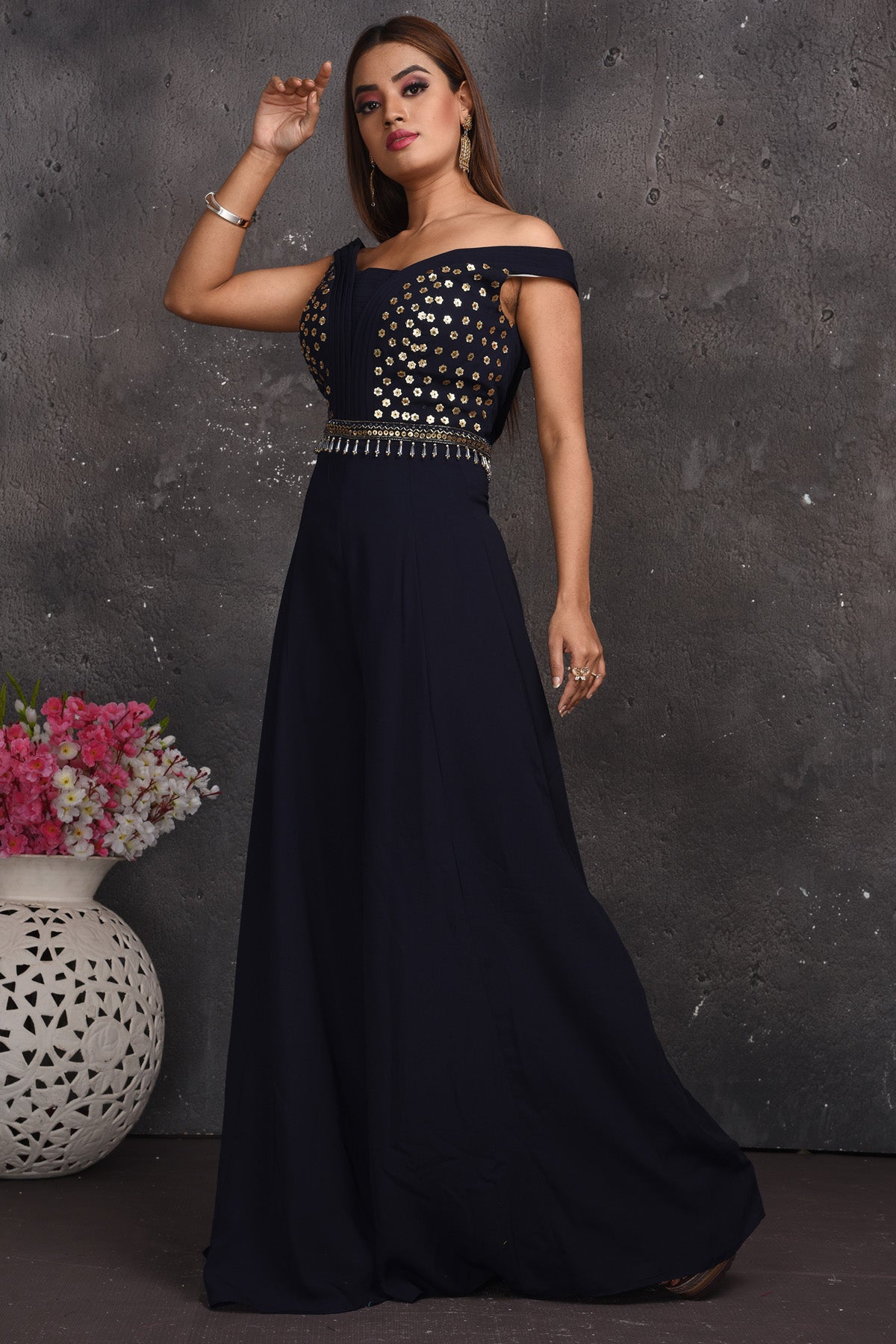 Shop beautiful black embroidered off-shoulder designer jumpsuit online in USA. Look your best at weddings and special occasions in exclusive designer lehengas, Anarkali suits, sharara suits. designer gowns and Indian dresses from Pure Elegance Indian fashion store in USA.-left