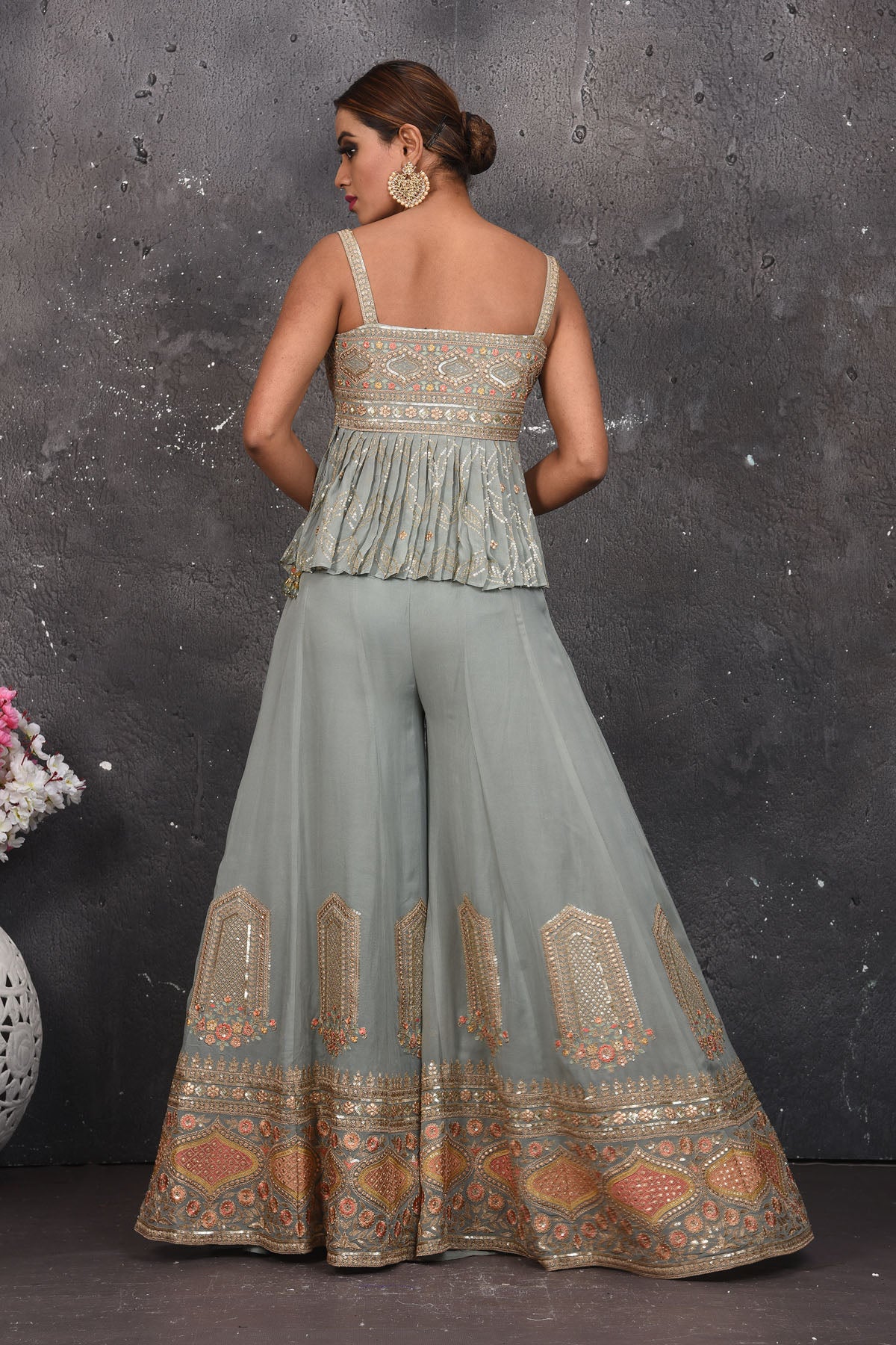 Shop stunning light grey embroidered peplum sharara suit online in USA. Look your best at weddings and special occasions in exclusive designer lehengas, Anarkali suits, sharara suits. designer gowns and Indian dresses from Pure Elegance Indian fashion store in USA.-back