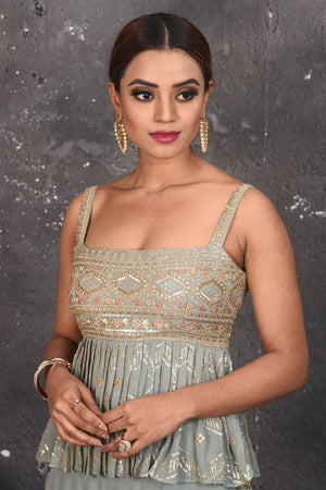 Shop stunning light grey embroidered peplum sharara suit online in USA. Look your best at weddings and special occasions in exclusive designer lehengas, Anarkali suits, sharara suits. designer gowns and Indian dresses from Pure Elegance Indian fashion store in USA.-closeup