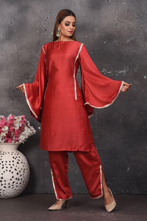 Buy beautiful dark red designer pant suit online in USA with dupatta. Look your best at weddings and special occasions in exclusive designer lehengas, Anarkali suits, sharara suits. designer gowns and Indian dresses from Pure Elegance Indian fashion store in USA.-front