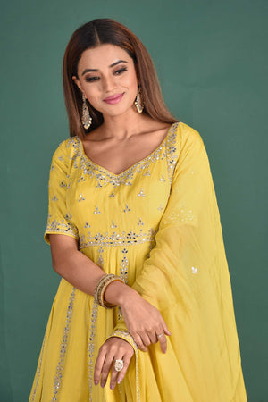 Buy beautiful yellow embroidered peplum sharara suit online in USA with dupatta. Dazzle on weddings and special occasions with exquisite Indian designer dresses, sharara suits, designer lehengas Anarkali suits, wedding lehengas from Pure Elegance Indian fashion store in USA.-closeup