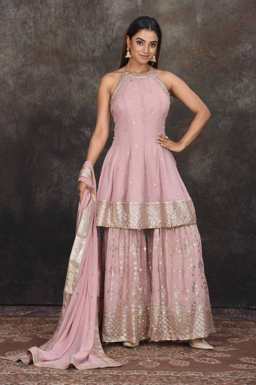 Buy beautiful mauve halter neck embroidered sharara suit online in USA with dupatta. Dazzle at sangeet and wedding occasions in this beautiful designer lehengas, Anarkali suits, sharara suit, bridal gowns, bridal lehengas from Pure Elegance Indian fashion store in USA.-full view
