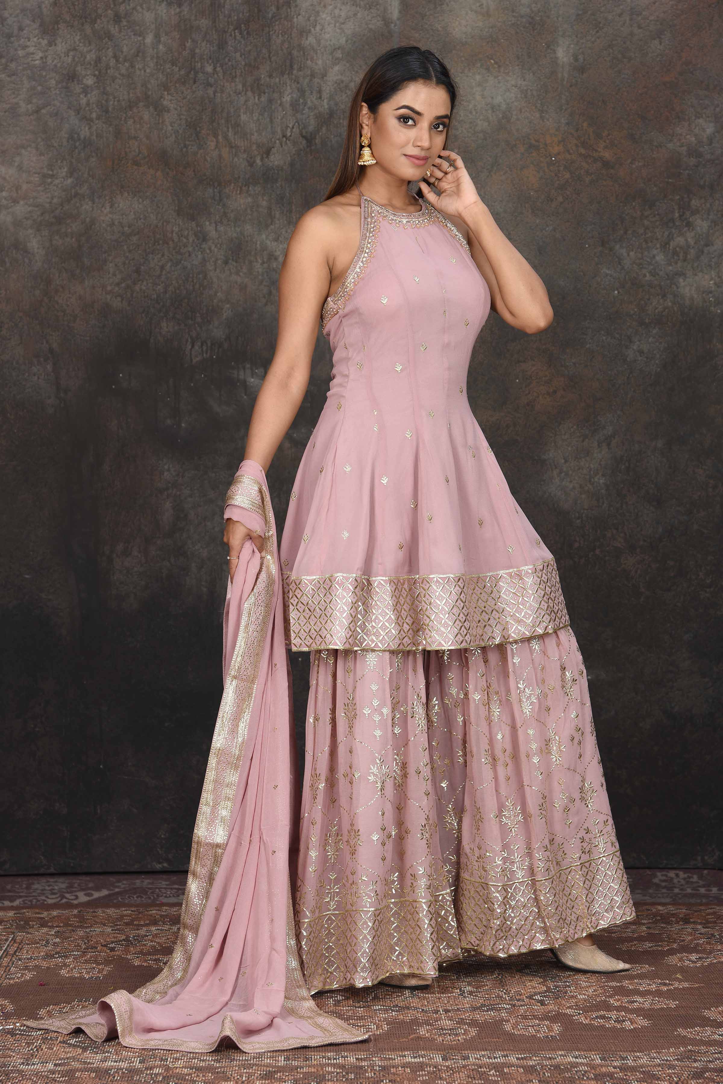 Buy beautiful mauve halter neck embroidered sharara suit online in USA with dupatta. Dazzle at sangeet and wedding occasions in this beautiful designer lehengas, Anarkali suits, sharara suit, bridal gowns, bridal lehengas from Pure Elegance Indian fashion store in USA.-side