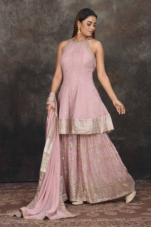 Buy beautiful mauve halter neck embroidered sharara suit online in USA with dupatta. Dazzle at sangeet and wedding occasions in this beautiful designer lehengas, Anarkali suits, sharara suit, bridal gowns, bridal lehengas from Pure Elegance Indian fashion store in USA.-sharara