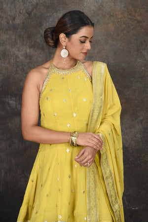 Shop stunning yellow halter neck embroidered sharara suit online in USA with dupatta. Dazzle at sangeet and wedding occasions in this beautiful designer lehengas, Anarkali suits, sharara suit, bridal gowns, bridal lehengas from Pure Elegance Indian fashion store in USA.-closeup