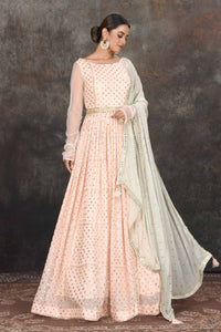 Buy beautiful light peach embroidered Anarkali suit online in USA with mint green embroidered dupatta. Dazzle at sangeet and wedding occasions in this beautiful designer lehengas, Anarkali suits, sharara suit, bridal gowns, bridal lehengas from Pure Elegance Indian fashion store in USA.-full view