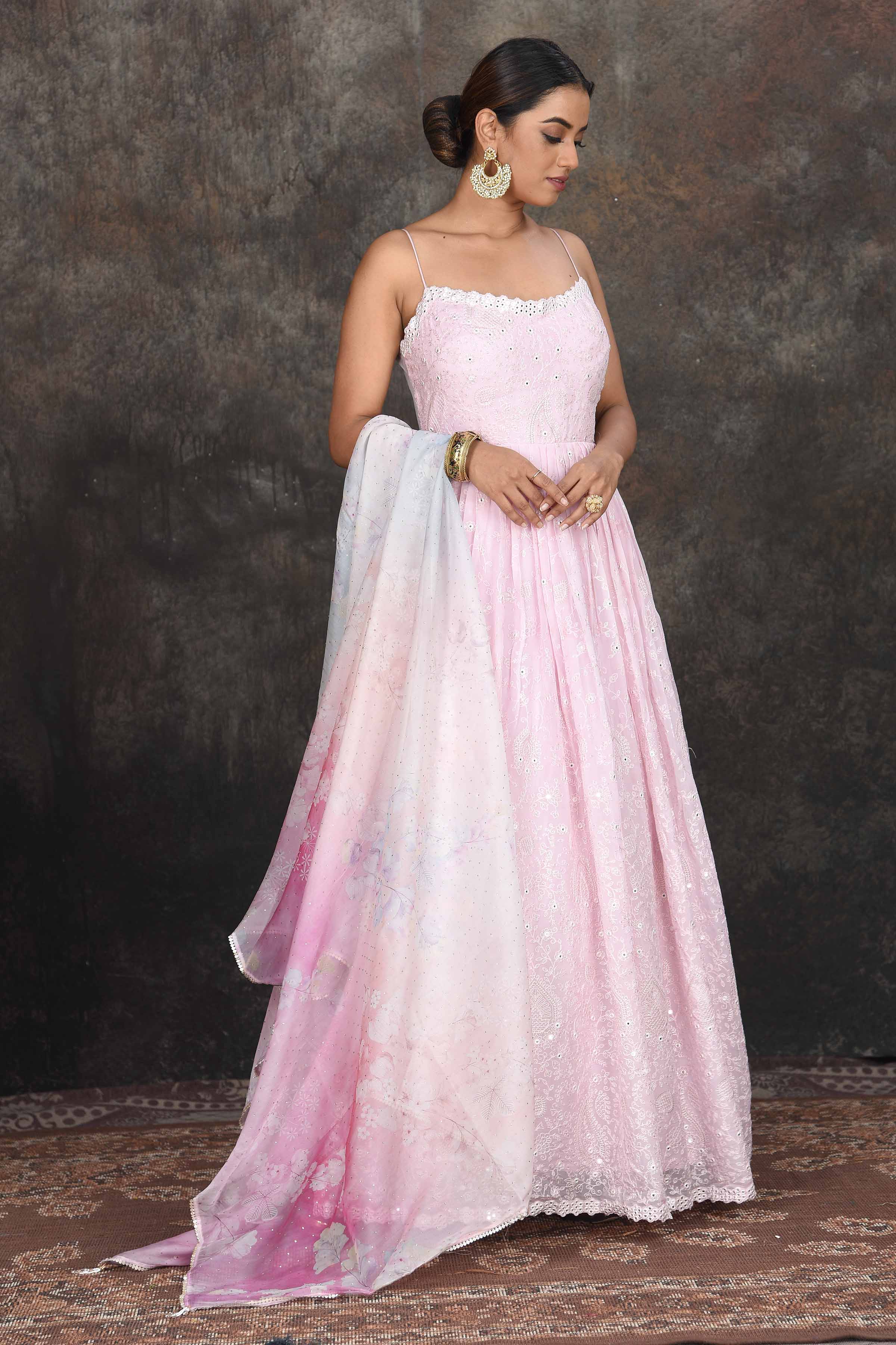 Buy stunning powder pink embroidered Anarkali suit online in USA with floral dupatta. Dazzle at sangeet and wedding occasions in this beautiful designer lehengas, Anarkali suits, sharara suit, bridal gowns, bridal lehengas from Pure Elegance Indian fashion store in USA.-front