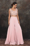 Buy stunning powder pink applique work crop top online in USA with palazzo. Dazzle at sangeet and wedding occasions in this beautiful designer lehengas, Anarkali suits, sharara suit, bridal gowns, bridal lehengas from Pure Elegance Indian fashion store in USA.-full view