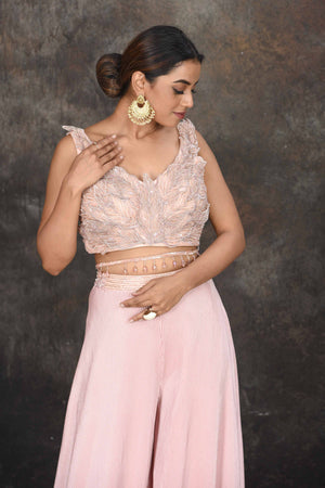 Buy stunning powder pink applique work crop top online in USA with palazzo. Dazzle at sangeet and wedding occasions in this beautiful designer lehengas, Anarkali suits, sharara suit, bridal gowns, bridal lehengas from Pure Elegance Indian fashion store in USA.-closeup