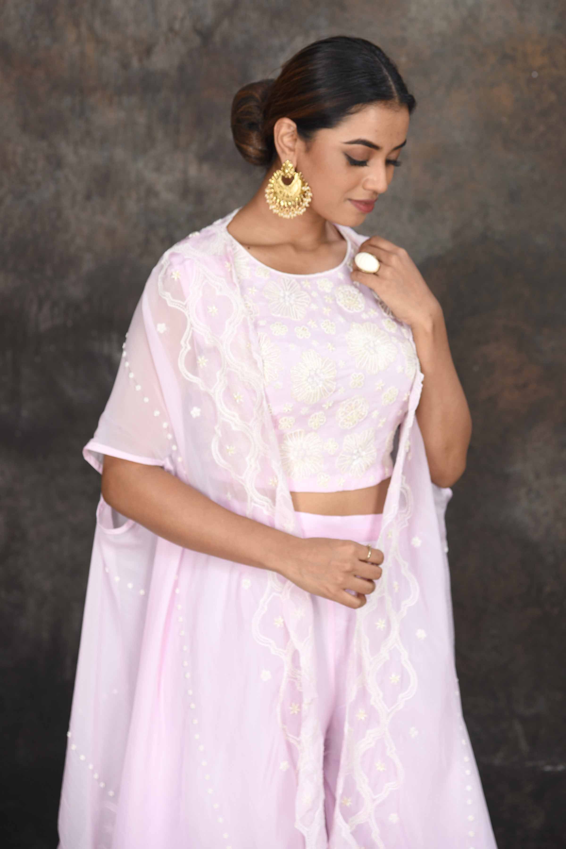 Buy powder pink embroidered crop top with palazzo online in USA and shrug. Dazzle at sangeet and wedding occasions in this beautiful designer lehengas, Anarkali suits, sharara suit, bridal gowns, bridal lehengas from Pure Elegance Indian fashion store in USA.-closeup