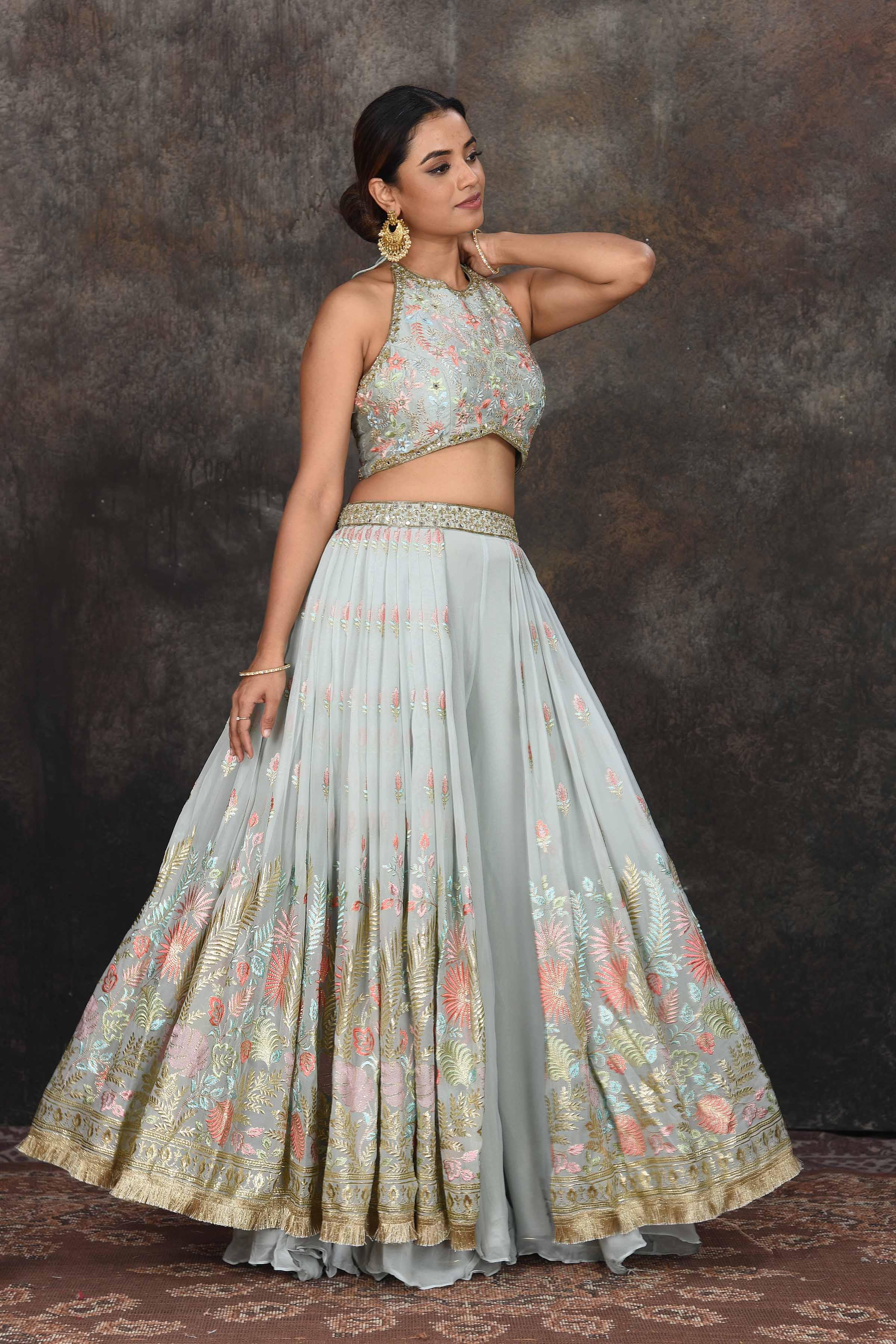 Shop stunning sage green embroidered halter neck lehenga online in USA. Dazzle at sangeet and wedding occasions in this beautiful designer lehengas, Anarkali suits, sharara suit, bridal gowns, bridal lehengas from Pure Elegance Indian fashion store in USA.-full view
