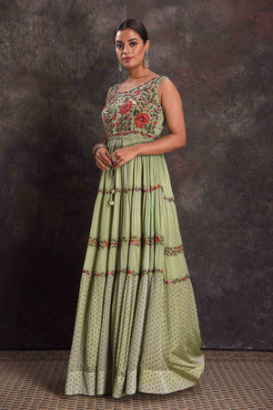 Shop beautiful pista green embroidered sleeveless party gown online in USA. Look your ethnic best on festive occasions with latest designer sarees, pure silk sarees, Kanchipuram silk sarees, designer dresses, Anarkali suits, gown, embroidered sarees from Pure Elegance Indian fashion store in USA.-left