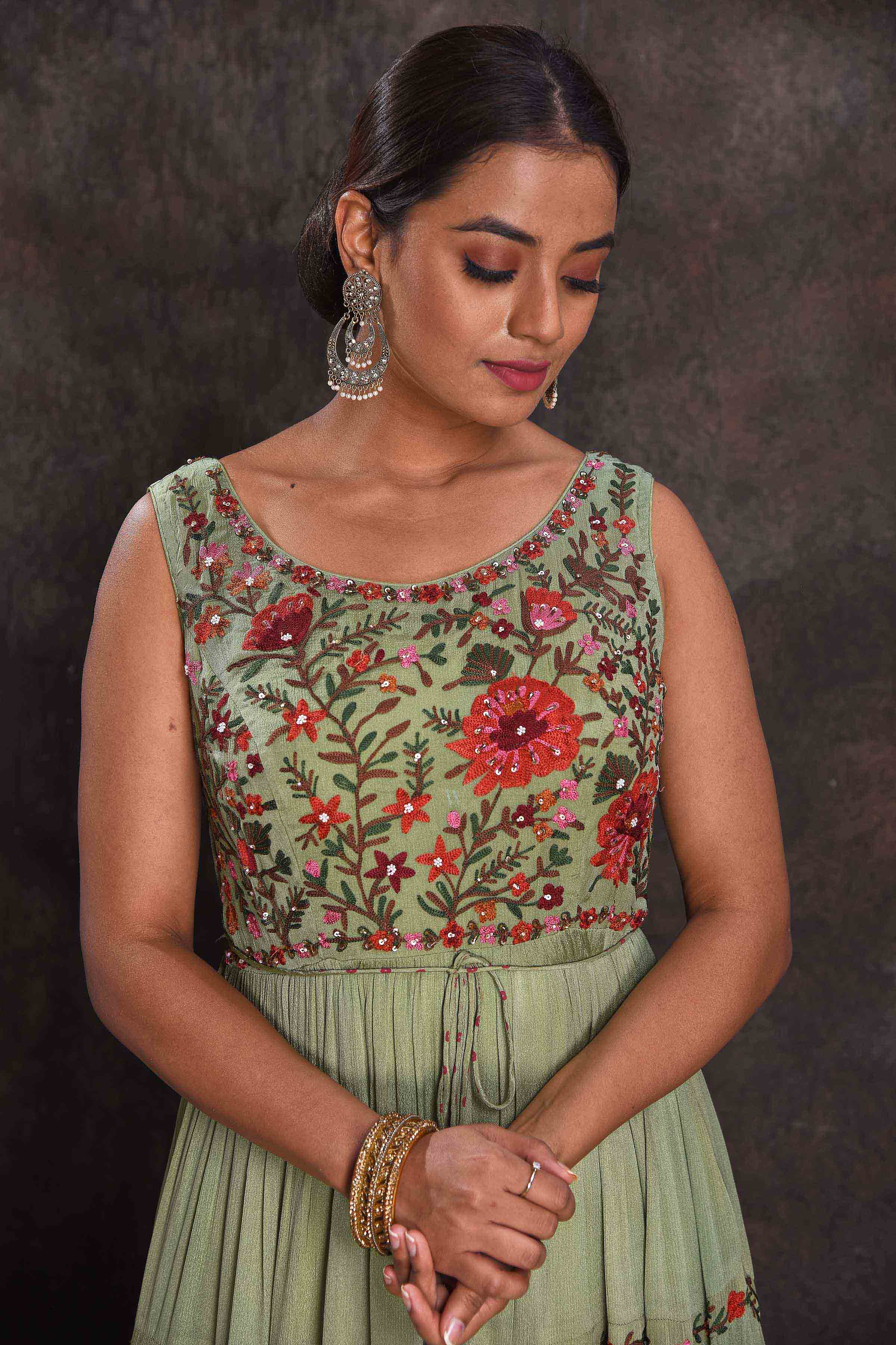 Shop beautiful pista green embroidered sleeveless party gown online in USA. Look your ethnic best on festive occasions with latest designer sarees, pure silk sarees, Kanchipuram silk sarees, designer dresses, Anarkali suits, gown, embroidered sarees from Pure Elegance Indian fashion store in USA.-neckline