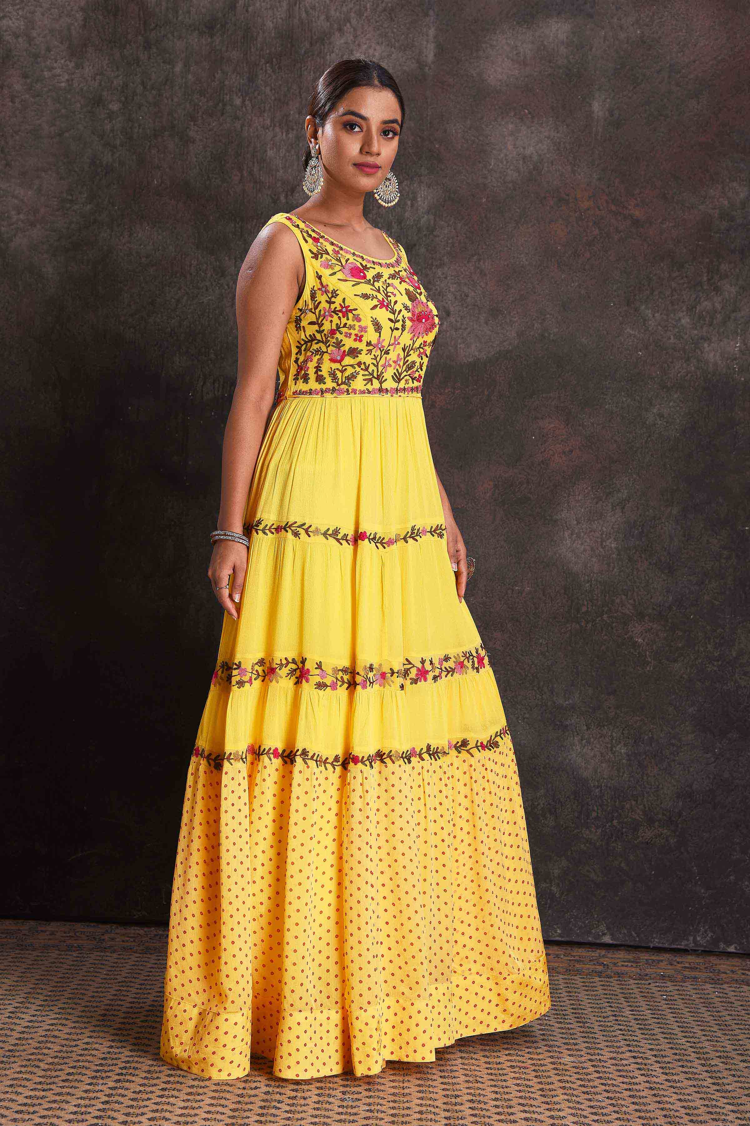 Buy beautiful yellow embroidered sleeveless party gown online in USA. Look your ethnic best on festive occasions with latest designer sarees, pure silk sarees, Kanchipuram silk sarees, designer dresses, Anarkali suits, gown, embroidered sarees from Pure Elegance Indian fashion store in USA.-side