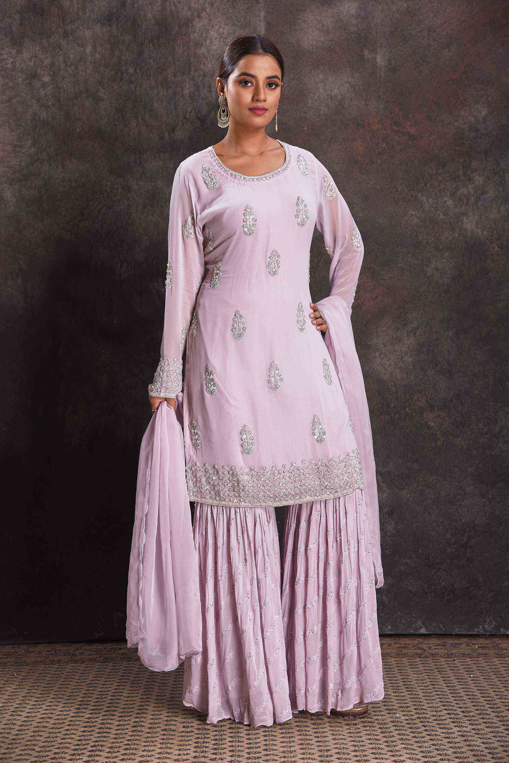 Shop stunning lilac embroidered sharara suit online in USA with dupatta. Look your ethnic best on festive occasions with latest designer sarees, pure silk sarees, Kanchipuram silk sarees, designer dresses, Anarkali suits, gown, embroidered sarees from Pure Elegance Indian fashion store in USA.-full view