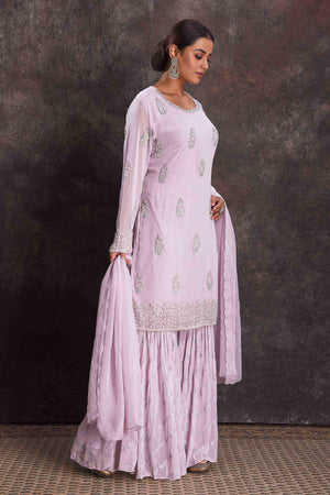 Shop stunning lilac embroidered sharara suit online in USA with dupatta. Look your ethnic best on festive occasions with latest designer sarees, pure silk sarees, Kanchipuram silk sarees, designer dresses, Anarkali suits, gown, embroidered sarees from Pure Elegance Indian fashion store in USA.-right
